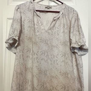 Loft blouse with ruffled elastic sleeves and V neck. Colors are pink and white.